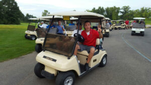 Andrew on golf cart